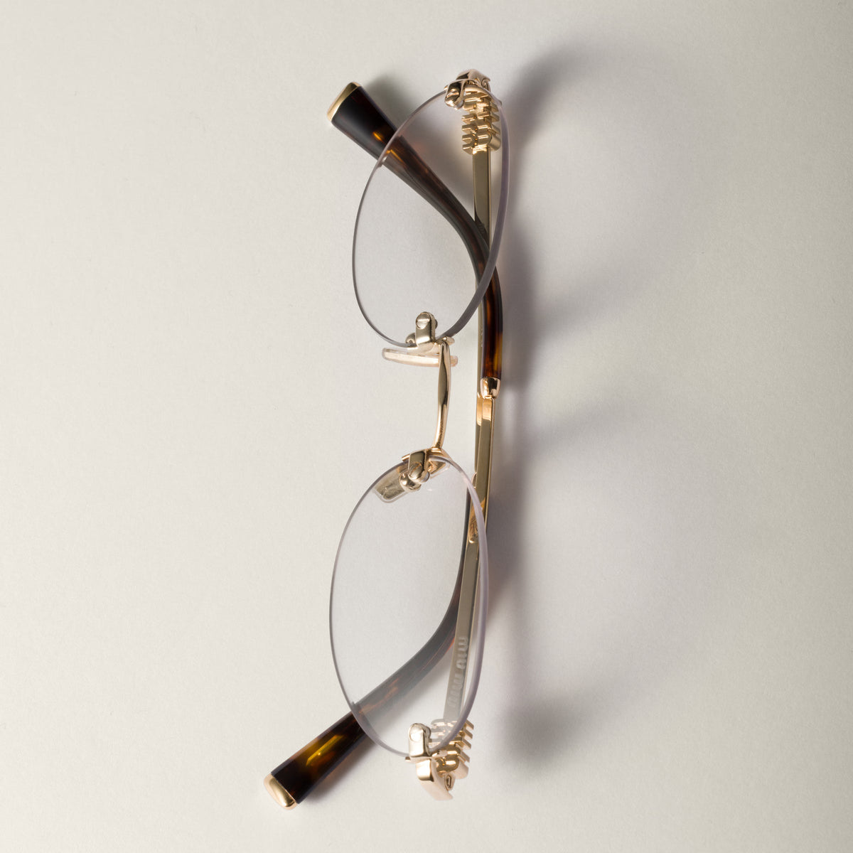 Miu Miu Women's MU A54S Rimless Oval – Gold / Clear Blue-ray Transparent Glasses