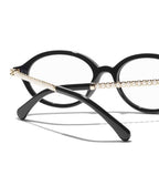CHANEL Women’s Oval Black Eyeglasses